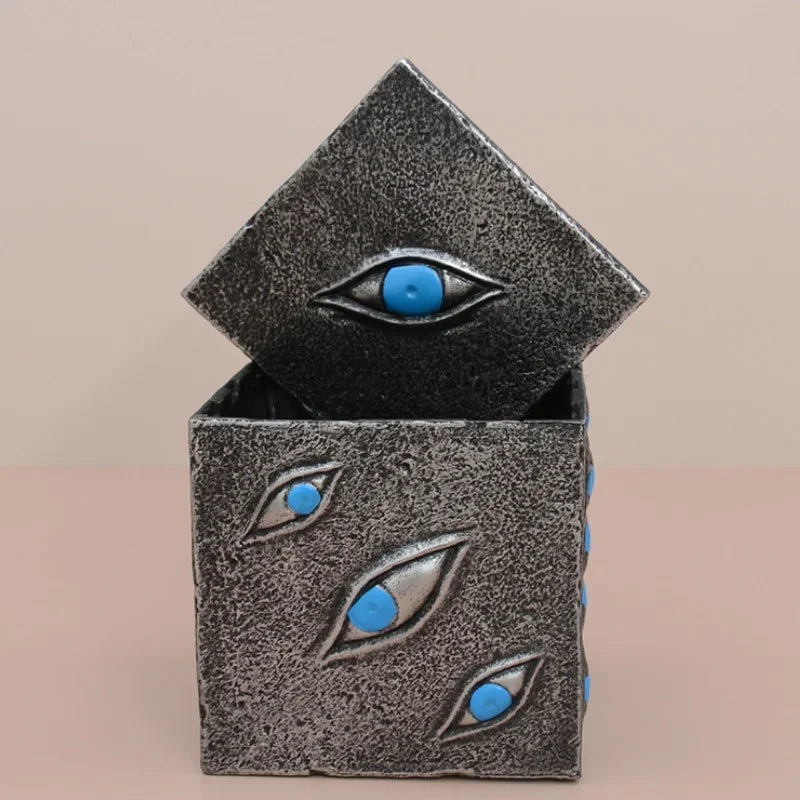 Cube boîte Prison avec ouverture et yeux bleus, texture grise