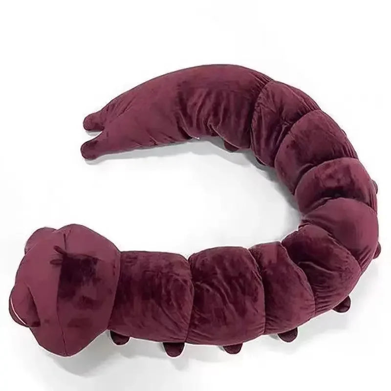 Accessoire plush violet en forme d’anneau de bras rembourré, extrémités arrondies.