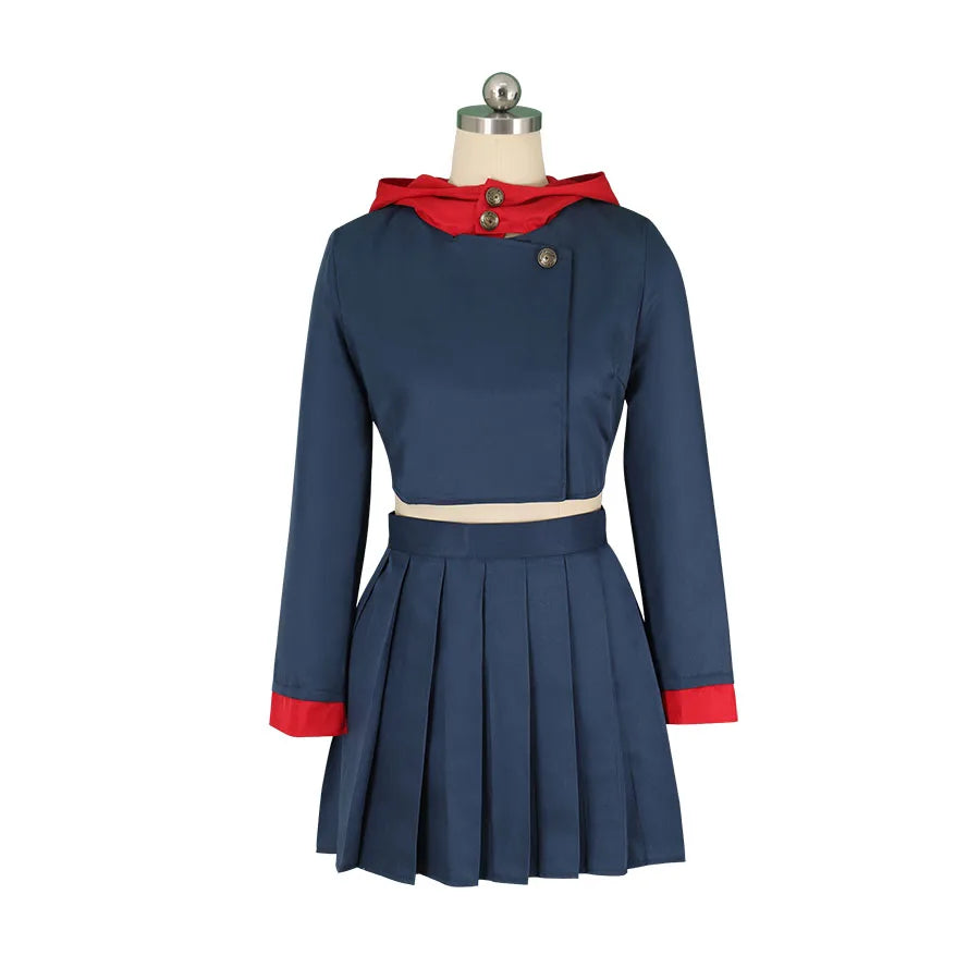 Veste bleu foncé à boutons, col rouge drapé, jupe plissée courte, costume femme