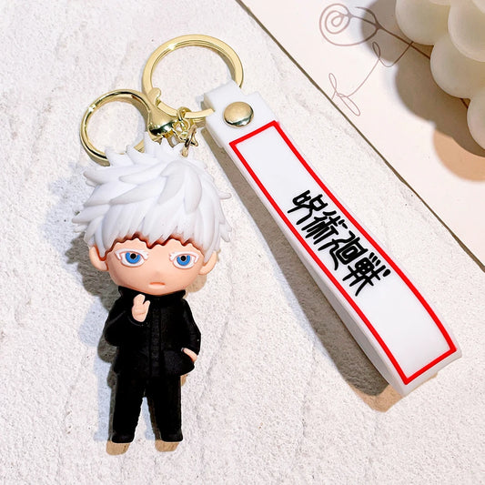 Porte-clé figurine cheveux blancs, tenue noire, lanière blanche bordée rouge