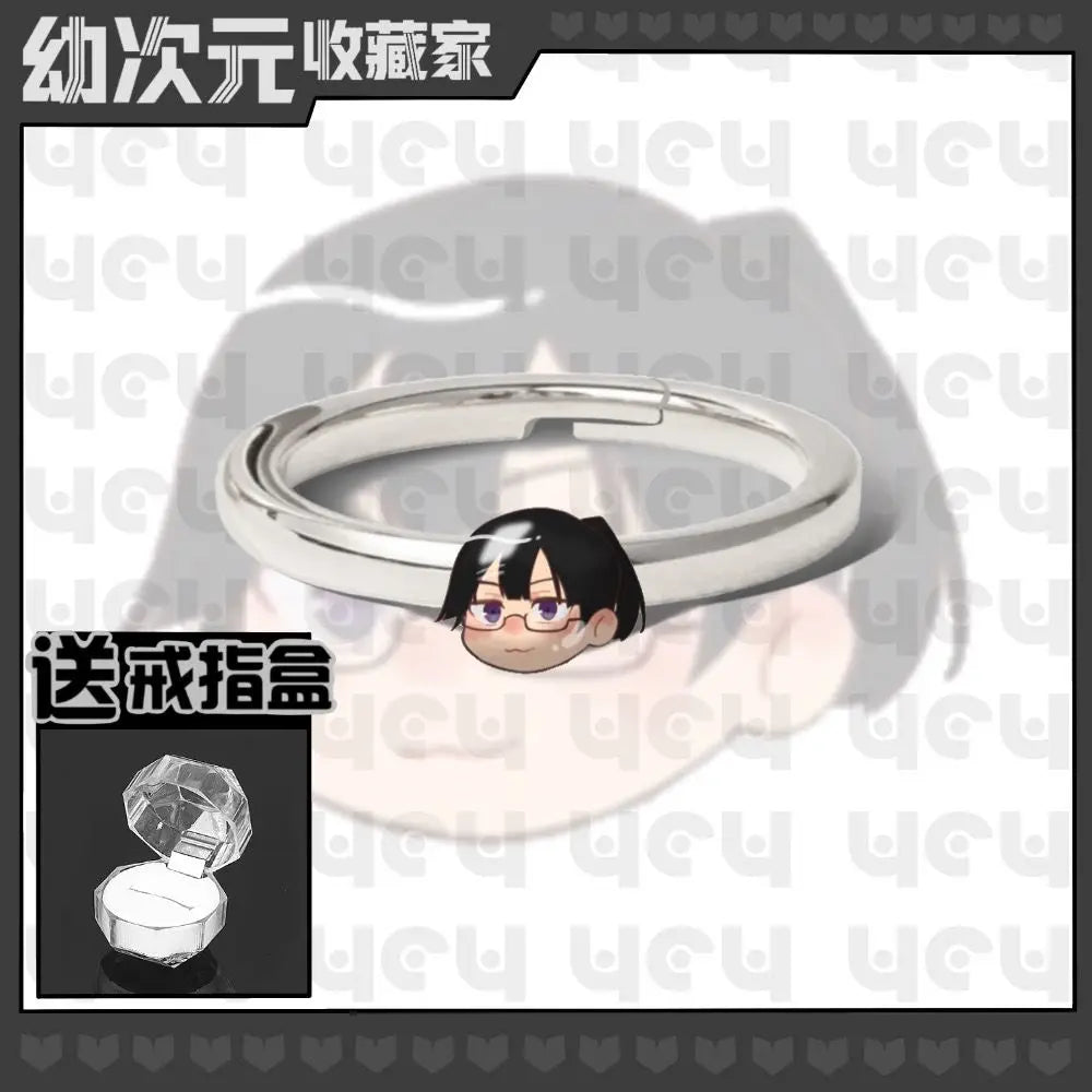 Bague en métal argenté avec tête chibi cheveux noirs et lunettes