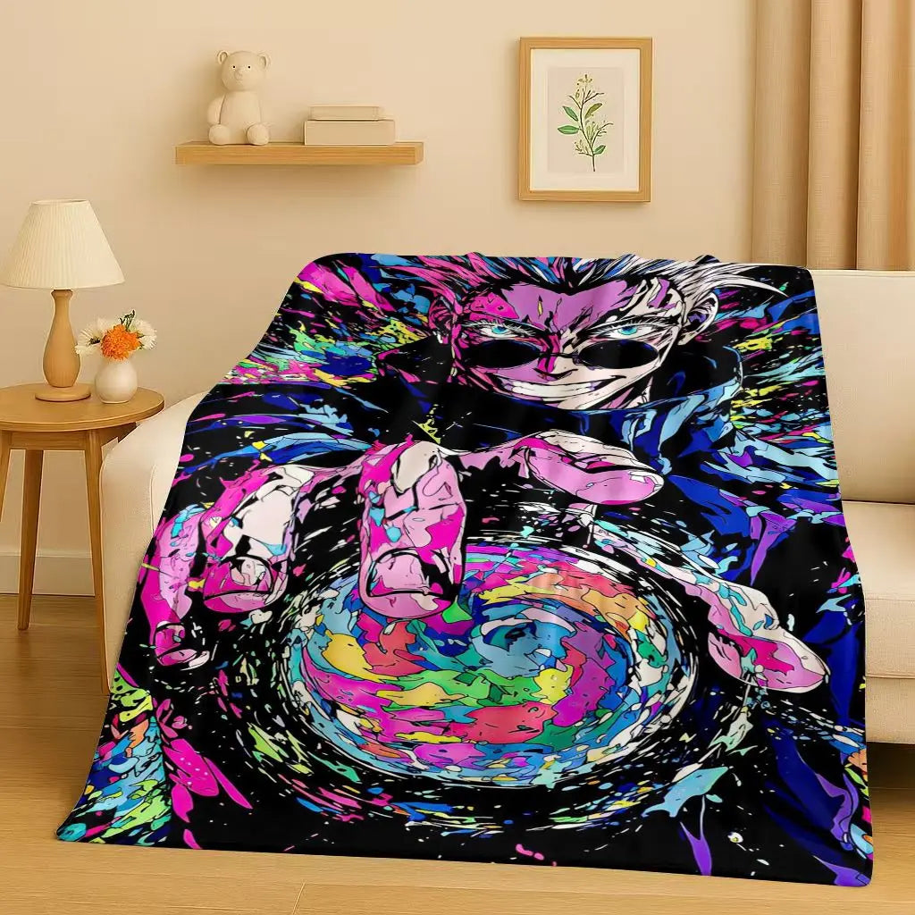 Couverture plaid multicolore avec illustration anime sur fond sombre.