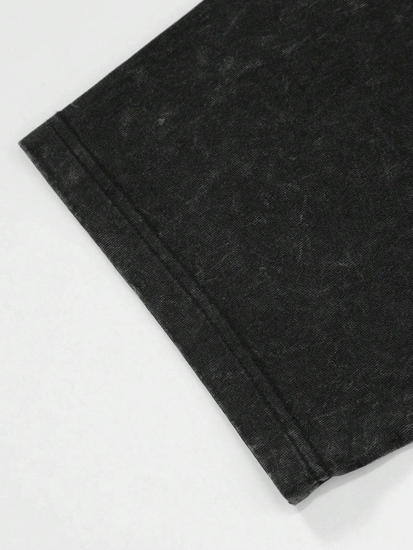 Bas de T-shirt noir avec ourlet, texture chinée visible