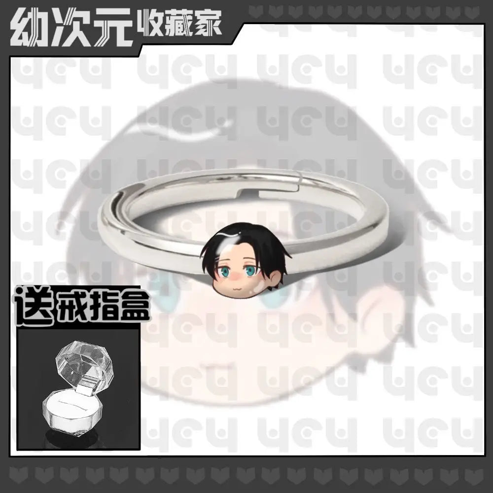 Bague en métal argenté avec tête chibi cheveux noirs et yeux bleus